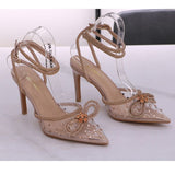 Escarpins à talons aiguilles en transparent avec strass